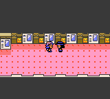 "Pokémon Crystal Version" screenshot of the player character being led by an NPC down a hallway in the Battle Tower.