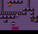 "Pokémon Crystal Version" screenshot of the player character is standing inside the Burnt Tower. NPC characters such as Silver, Morty, and Eusine are also present.