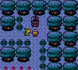 "Pokémon Crystal Version" screenshot of the player character standing outside the shrine in Ilex Forest as a sprite of Celebi floats down to them to initiate an encounter.