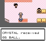 "Pokémon Crystal Version" screenshot of the player character standing at the entrance of a Pokémon Center as an NPC clerk faces them. A text box at the bottom of the screen displays, "CRYSTAL received GS BALL."